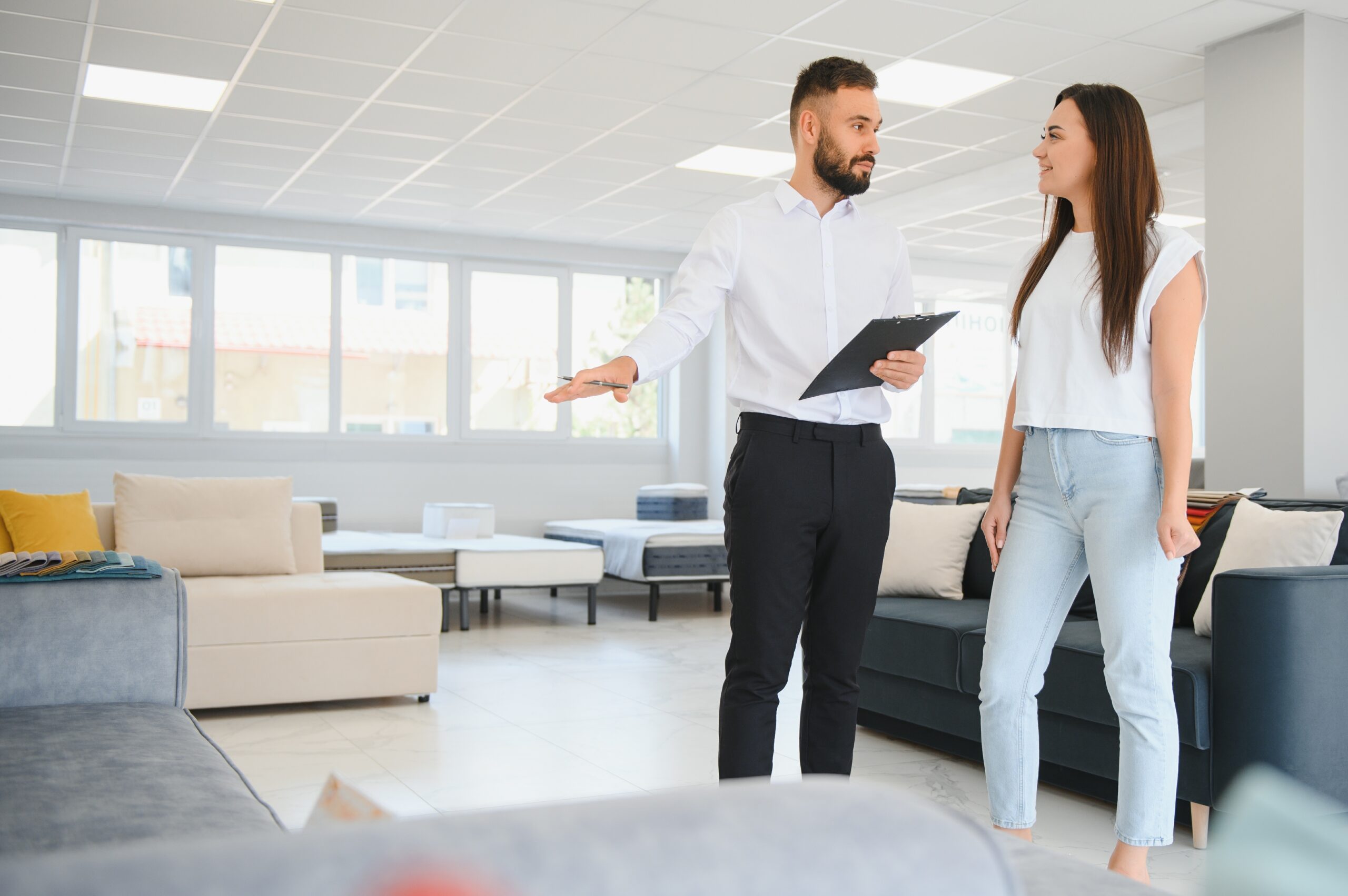 A salesman helping a customer out in the store