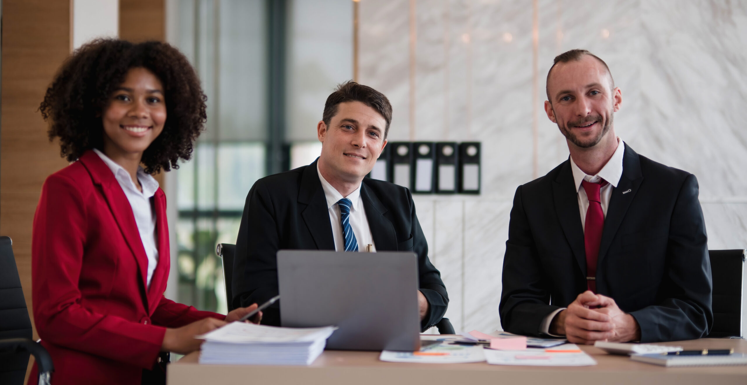 Three professionals highlight teamwork and growth in sales representative jobs.