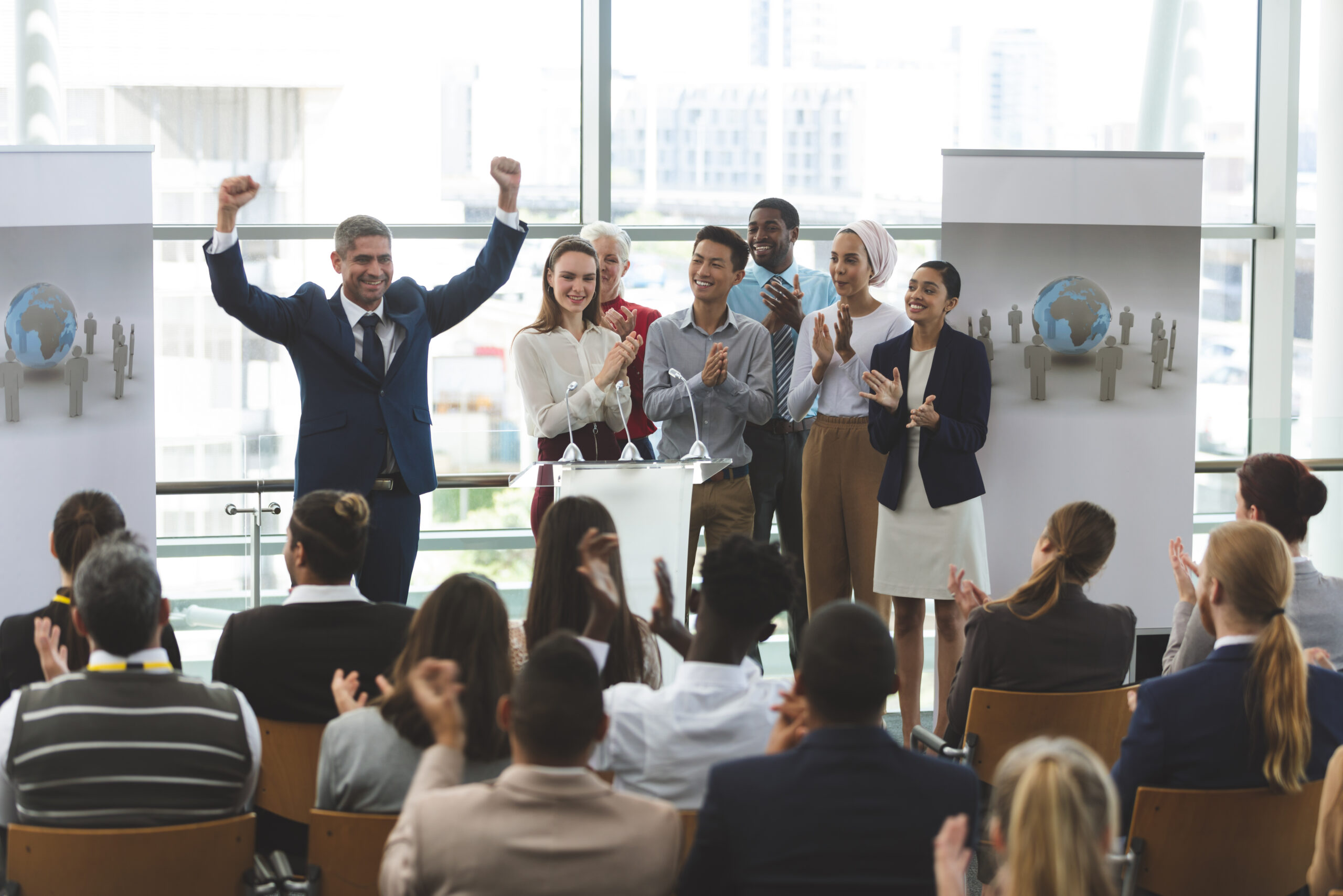 Marketing professionals applauding a successful presentation.
