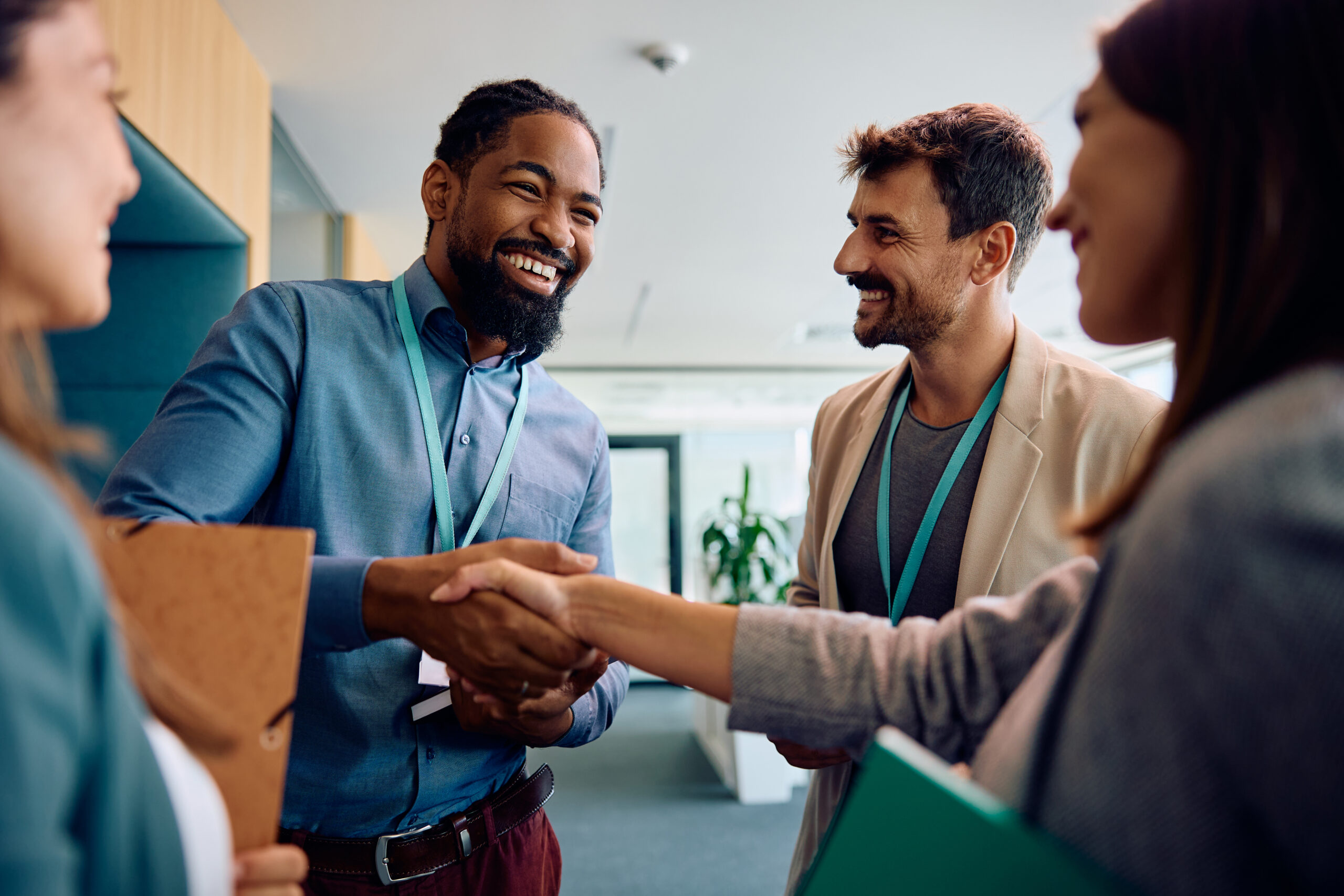Professionals shaking hands, highlighting growth and opportunity in sales careers.