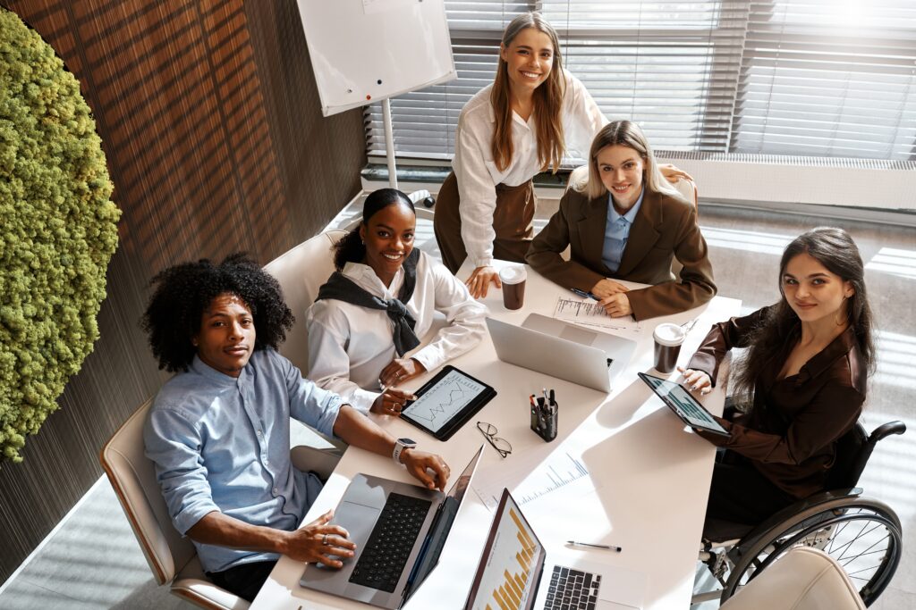 Professionals at a direct marketing agency reviewing performance data during a team meeting.